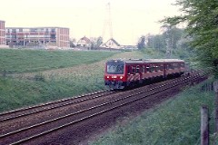 DSB MR class photographed in Fredericia heading for Kolding, June 1982.  The MR class was purchased from 1978 to 1985 in a number of 98. The first 30 were built by Uerdingen in Germany, the rest by Scandia in Denmark. Dieselhydraulic Deutz engine. 325 hp. Max speed 120 km/h - 75 mph. Length each unit 22 335 mm. Weight 34,5 metric tonnes. One trainset consists of two units. In 1995 - 1997 renovated and painted in a white/red colourscheme. Increased max. speed to 130 km/h - 81 mph.